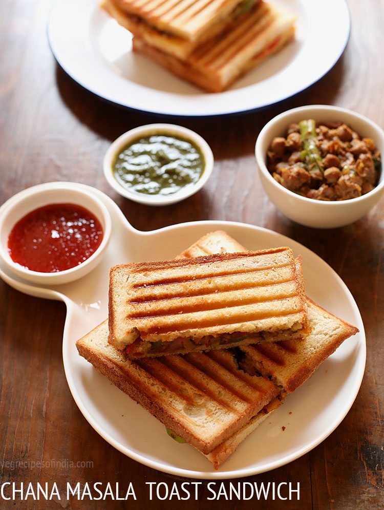 chana sandwich cut into pieces and served on a white platter with tomato sauce and text layover.
