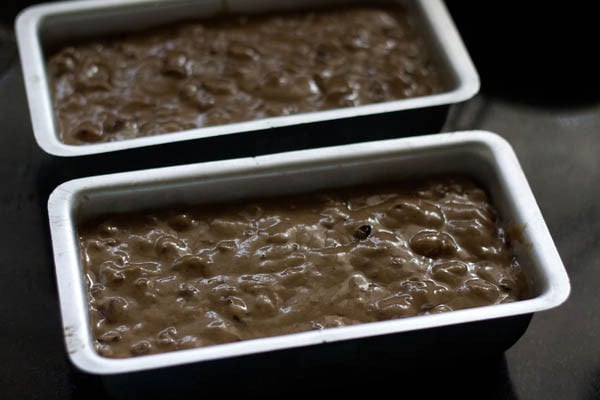 prepared batter poured in 2 lined cake tins. 