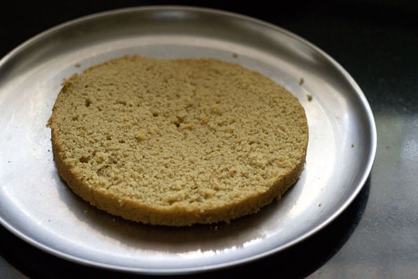 sliced cake halve on a plate.