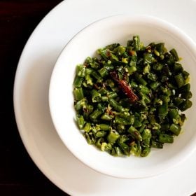 beans poriyal served in a white bowl