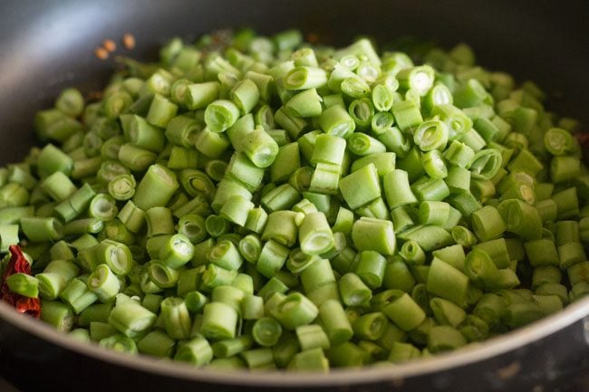 adding chopped french beans