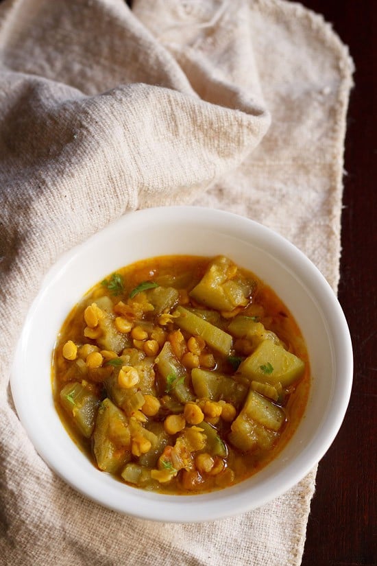 lauki chana dal served in a white bowl