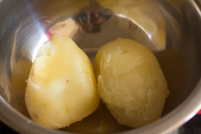 Place peeled potatoes in a bowl. 