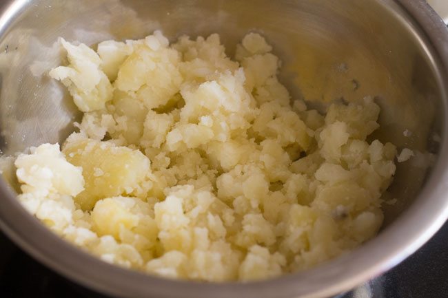 Place mashed potatoes in a bowl. 