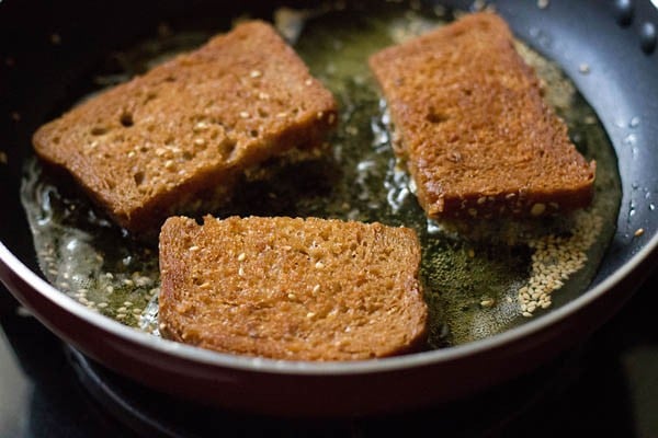 frying sesame toasts till golden. 