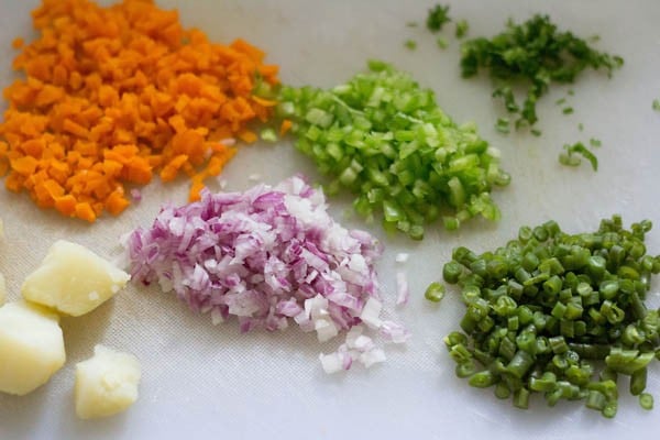 finely chopped vegetables and mashed boiled potato for making filling for sesame toast. 