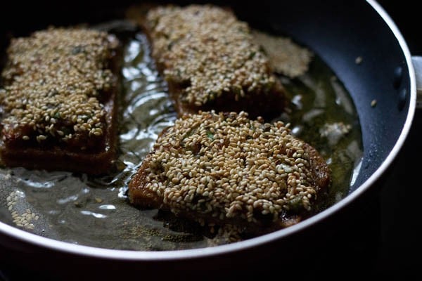 frying sesame toasts on the other side. 