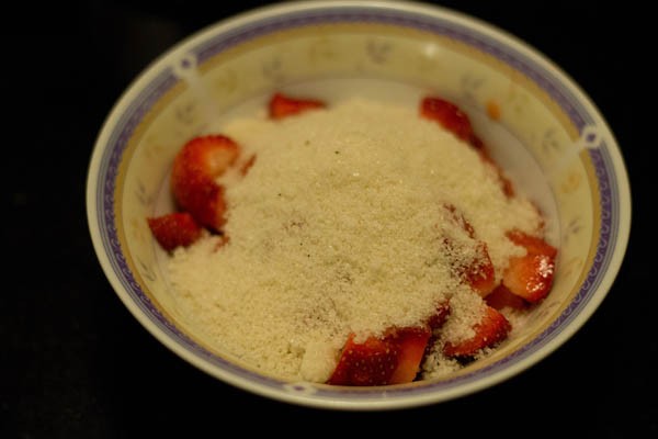 sugar and strawberries in a bowl