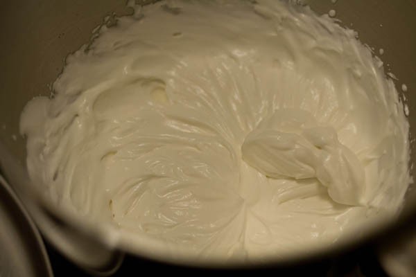 beaten whipped cream with stiff peaks