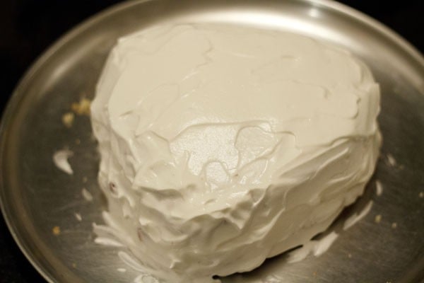 eggless strawberry cream cake covered in whipped cream