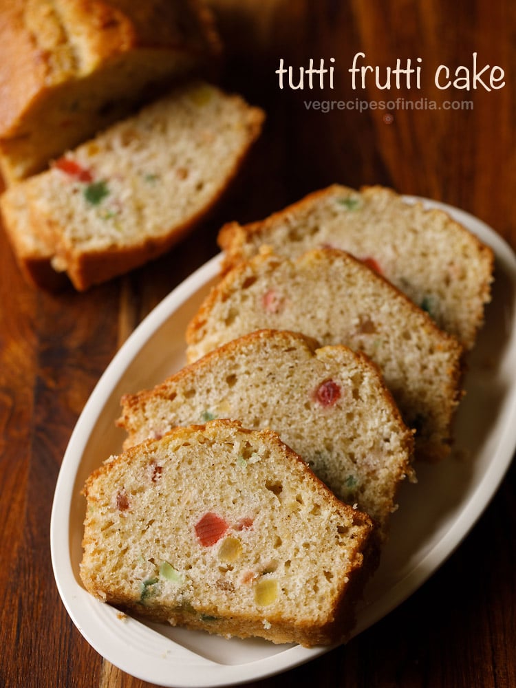 eggless tutti frutti cake placed on a white plate