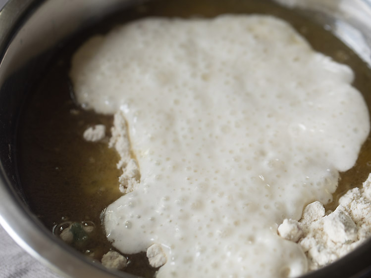 curd mixture added to flour