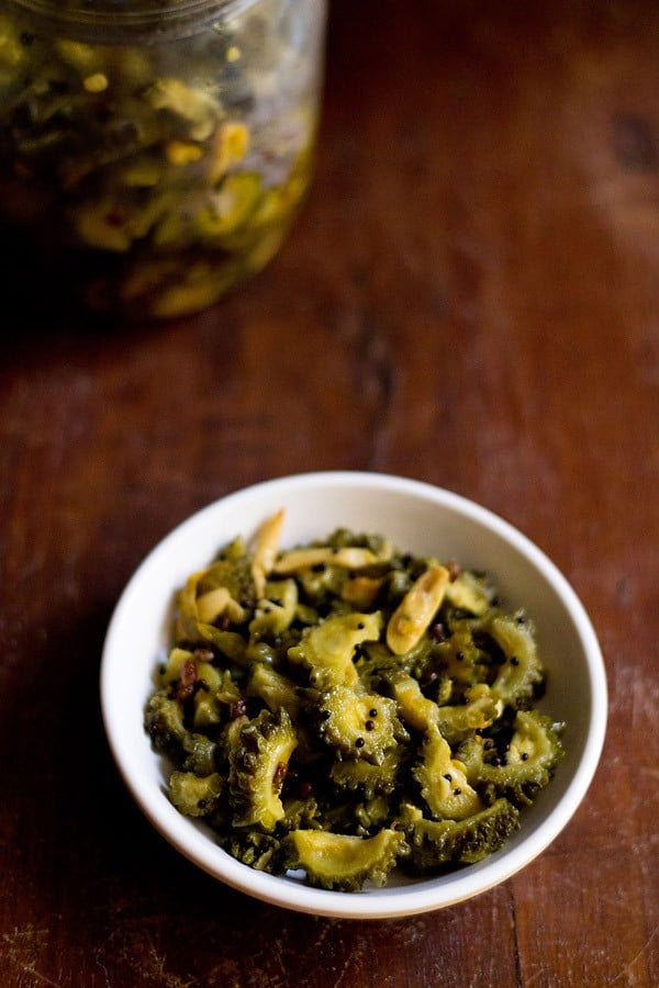 bitter gourd pickle in a white bowl.