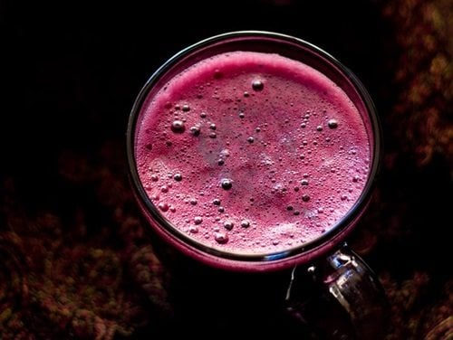 grape juice in glass mug.