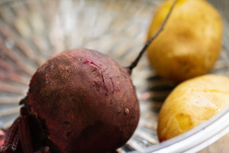 steamed beetroot and potatoes in a steamer pan