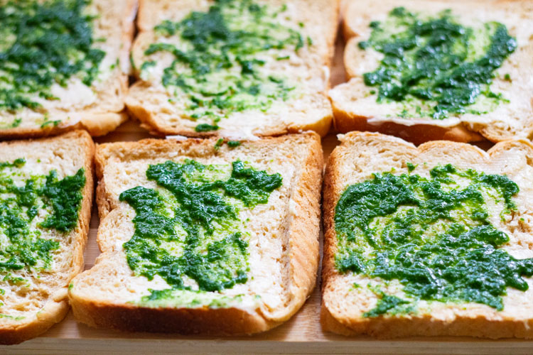 butter and green chutney spread on bread slices