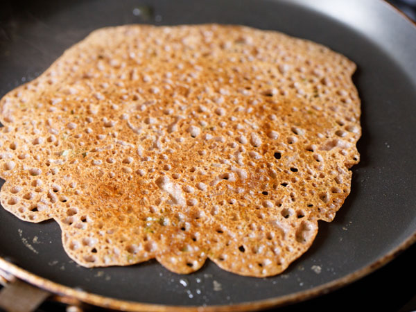 cook ragi dosa on tawa