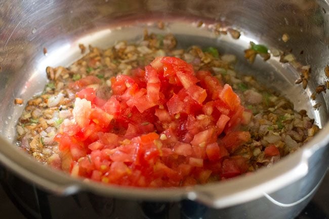 tomatoes added to pot