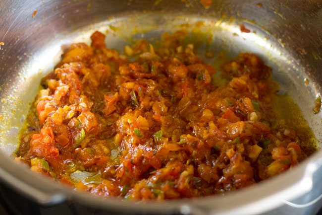 making kala chana masala, the oil is leaving the sides and the tomatoes are soft