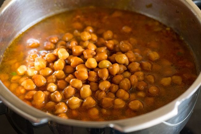 black chana added to pot with soaking water