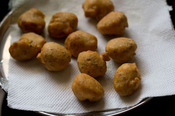 draining moong dal pakodas on paper napkins. 