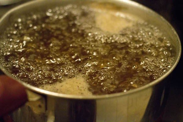 preparing sugar syrup for orange squash. 