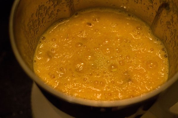 crushing oranges in a blender. 