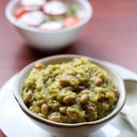palak khichdi served in a bowl.