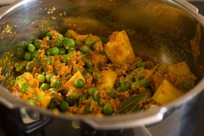 potato peas kurma after stirring with the masala paste before adding the liquid.