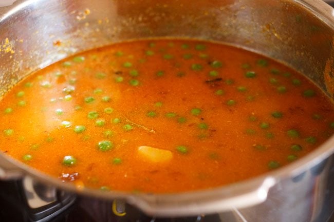 potato peas kurma in the pot before pressure cooking. 