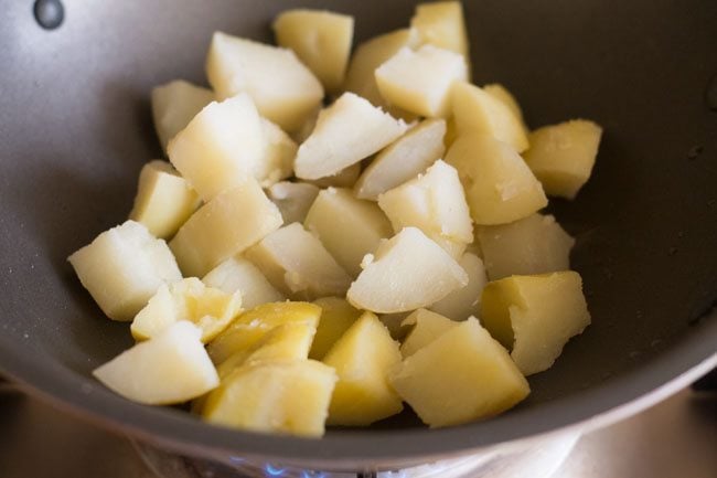 diced potatoes added to the pan. 