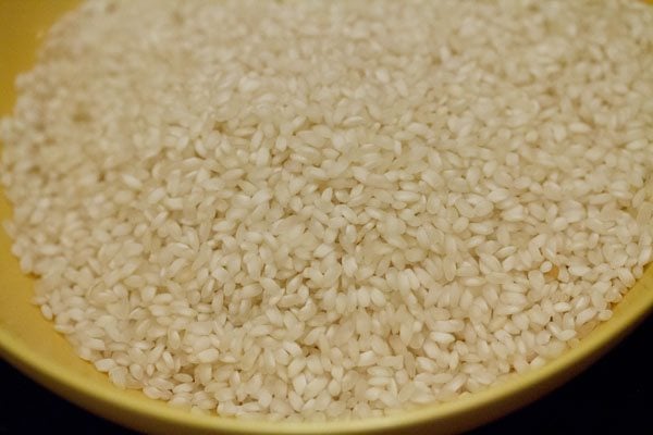 idli rice in a yellow bowl