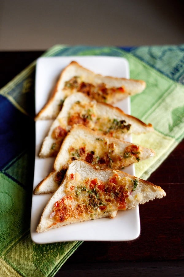 suji toast triangles served on a long white platter.