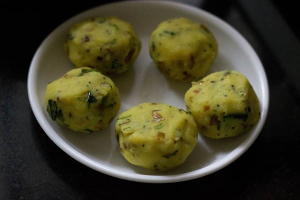 medium size balls made from spiced potato mixture for aloo bonda recipe. 