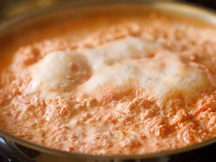 simmering gajar ka halwa milk and carrot mixture.