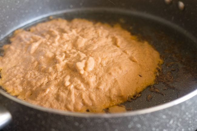ground masala paste added to pan