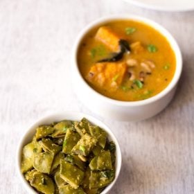 papdi bhaji served in a white bowl with a bowl of sambar kept in the top left side.