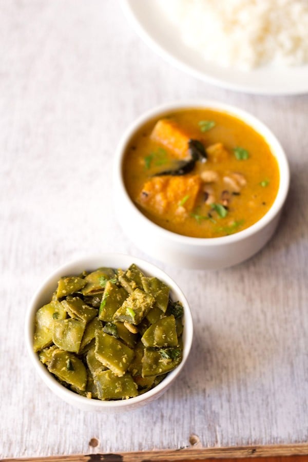 papdi bhaji served in a white bowl with a bowl of sambar kept in the top left side.