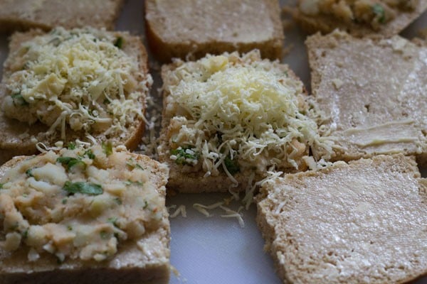 top the bread slices with grated cheese