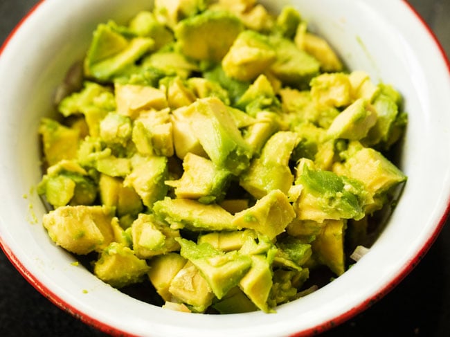 Place the chopped avocados in the mixing bowl