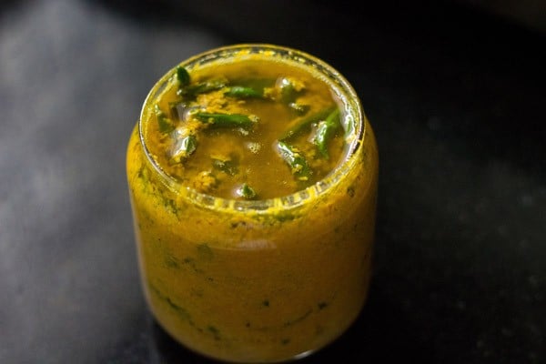 green chilli pickle or hari mirch ka achar in glass jar.