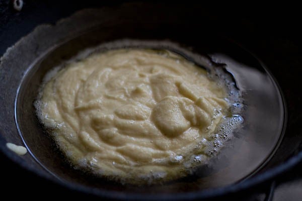 ground moong dal paste added to melted ghee. 