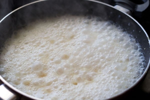 boiled milk mixture added to fried moong lentils. 