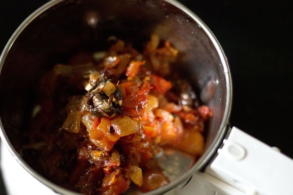 cooked tomato mixture and seedless tamarind added to a grinder jar. 