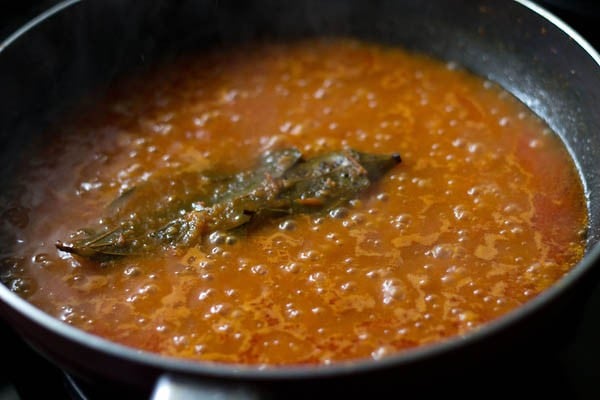 preparing paneer makhani recipe by reducing gravy prior to adding cream