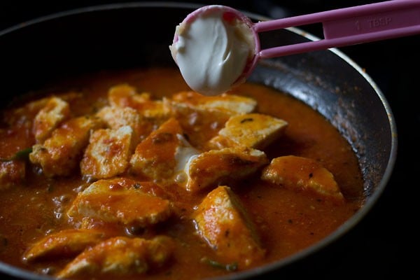 cream being added to paneer makhani recipe