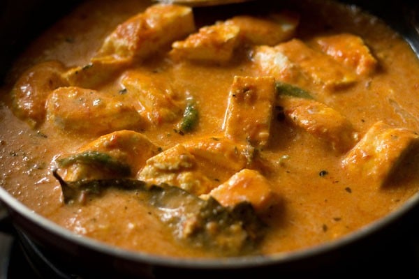 simmering makhani sauce with cubes of paneer