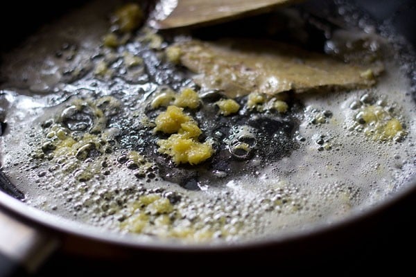 pan frying ginger garlic paste in oil with tej petta