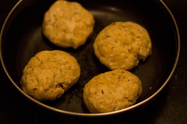 dough divided into 4 equal portions for papdi recipe. 