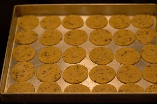papdi placed in a lightly greased baking tray. 